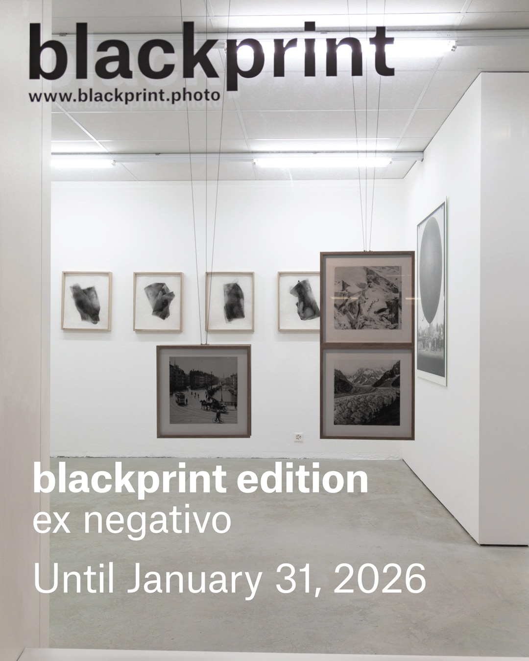 blackprint contemporary art gallery with black and white photos displayed in wooden frames, some hanging from the ceiling. Text reads: “blackprint edition ex negativo Until January 31, 2026.